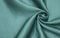Smooth elegant blue silk or satin luxury cloth texture can be used as abstract background. Crumpled fabric Twisted at the side