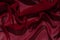 Smooth elegant burgundy chiffon fabric abstract background. Dark red wine silk luxury cloth texture light surface design