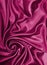 Smooth elegant burgundy silk or satin texture as background
