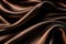 Smooth elegant chocolate brown color silk or satin cloth texture. Abstract background.