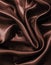 Smooth elegant dark brown chocolate silk as background