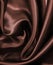 Smooth elegant dark brown chocolate silk as background