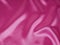 Smooth elegant pink silk can use as background. abstract pink silk. Pink satin fabric with folds