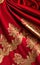 Smooth elegant red silk or satin luxury cloth texture as abstract background. Satin texture red and gold fabric.