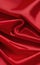 Smooth elegant red silk or satin luxury cloth texture as abstract background. Satin texture red and gold fabric.