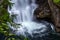 smooth long exposure of pools below waterfall with white spray