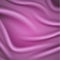 Smooth pink satin background with folds