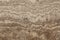 Smooth polished travertine surface - varieties of marble Travertino Classico beige with marble texture on stone