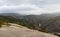 Smooth rocks and a reservoir in the mountains of Galicia.