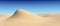 Smooth sand hill with waves under blue sky