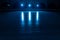 Smooth, shiny surface of an ice rink with reflected by spotlights. Dark empty ice arena with soft blue light. Concept of