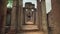 Smooth shot of outdoor corridor of ruins at Angkor Wat temple in Cambodia