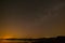 Smooth surface of the lake on background the starry sky