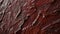 The smooth textured surface of the backsplash reveals layers of dark red tones reminiscent of the intricate flavors