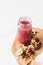 Smoothie of freeze-dried cherry, banana, apple, blueberry in a highball glass