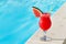 Smoothie juice drink Glass and swimming pool holiday tropical concept