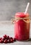 Smoothie, pink juice on the grey background.