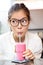 Smoothie - woman hipster with glasses drinking