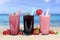 Smoothies fruit juice with fruits smoothie on the beach