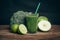 Smoothies and ingredients - avocado, apple, lime, celery, cucumber, broccoli, wooden rustic table background