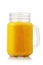 Smoothies made from ripe orange in glass jar isolated