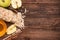 Smoothies with oatmeal, apple and cinnamon in glass jars on a wooden background.