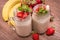 Smoothies with oatmeal ,strawberry, banana in glass jars