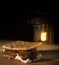 Smore on a wood surface with camping lantern behind