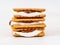 Smores, marshmallow sandwiches - traditional American sweet chocolate cookies on white wooden table, side view