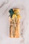 Smudging with palo santo. Palo santo sticks decorated with dry aromatic herbs over white marble table background