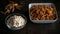 Snack insects. Mealworm larvae as food & bowl with flour. Mealworms crustaceans tenebrio molitor, freeze-dried for snacking. Fried