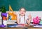 Snack between lessons. Schoolgirl sit desk chalkboard background. Kid student in school. Healthy lifestyle. School life
