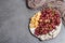 Snack plate with cheese, grapes and dried sausages. Charcuterie antipasto, stone concrete background