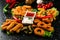 Snack platter French fries, chicken nugget, Turkish pastry, onion rings, potato croquette