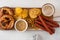 Snack to beer, Bavarian sausages, chips, brezels, crackers and mustard. Oktoberfest food.