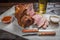 Snack to beer smoked pork shank on the Board for filing is covered with a sheet of parchment