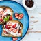 Snack from Wholemeal Bread Toasts, Ricotta cheese and Strawberri