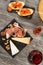 Snacks and appetizer, cheese, jamon, nuts, bruschettas and red w