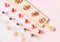 Snacks, brushetta sandwiches, gazpacho shots, desserts over pastel pink background
