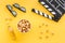 Snacks for film watching. Popcorn and soda near clapperboard, glasses on yellow background top view