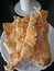 Snacks made of cassava flour with salt, onion and chilies to accompany coffee.