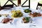 Snacks and meals on the table with a white tablecloth