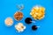 Snacks for TV watching. Chips, nuts, soda, rusks on blue background top view