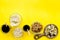 Snacks for TV watching. Chips, nuts, soda, rusks, dried fruits on yellow background top view copy space