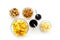 Snacks for TV watching. Chips, nuts, soda, rusks on white background top view