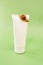 Snail cosmetics.Snail extract.Snails on a white tube on a green background.Organic cosmetics with snail slime.Cosmetic