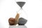 Snail and hourglass on a white background. The concept of slow time. Speed â€‹â€‹of time in a day