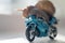 A snail rides a racing motorcycle, concept of speed and success, selective focus