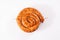 Snail sausage in traditional spiral on white background. Grilled round sausages . Delicious barbecue. There is a