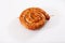 Snail sausage in traditional spiral on white background. Grilled round sausages . Delicious barbecue. There is a